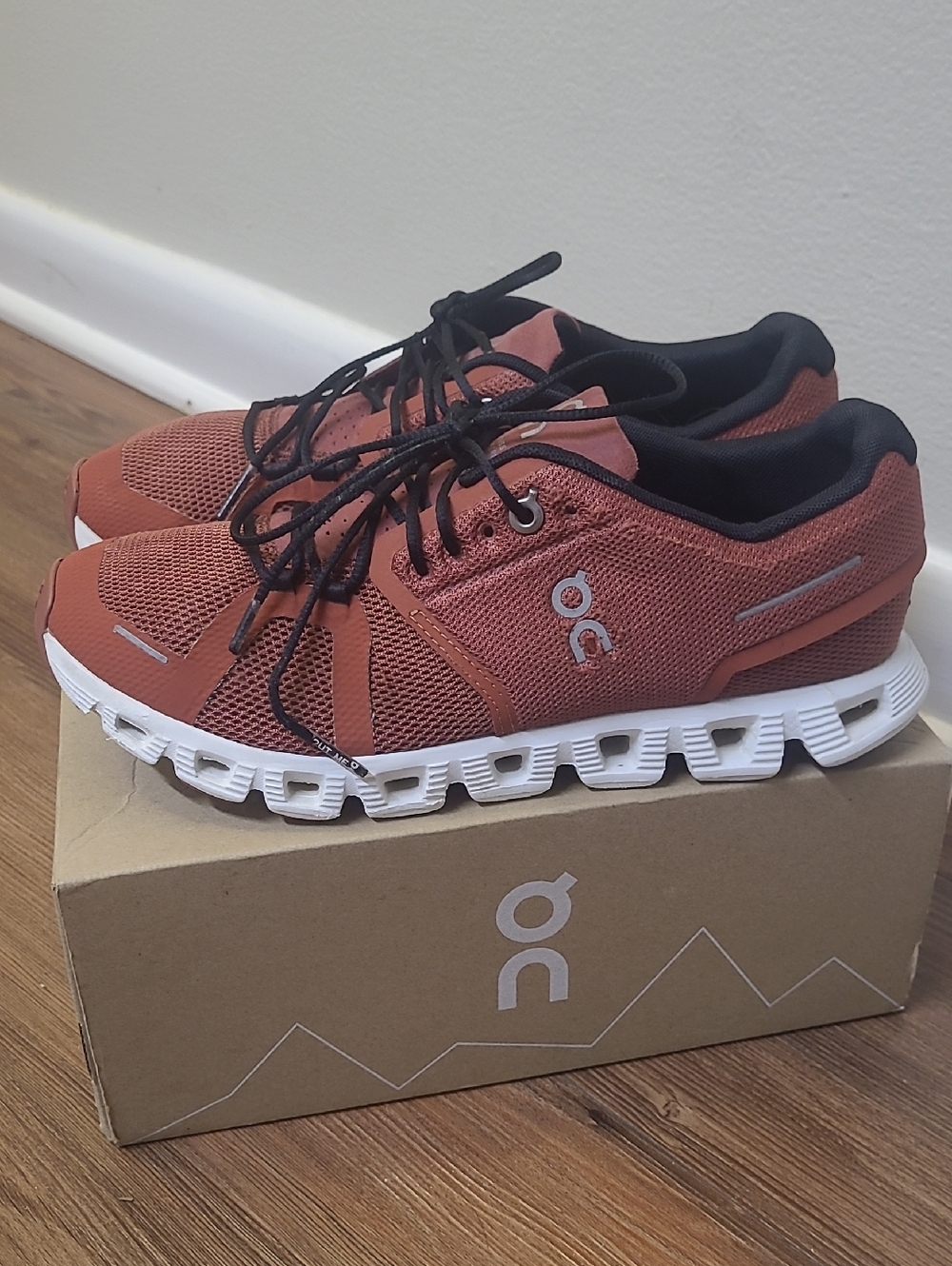 On Running women's Sneakers in Rust and Black with White CloudTec Sole w8 .